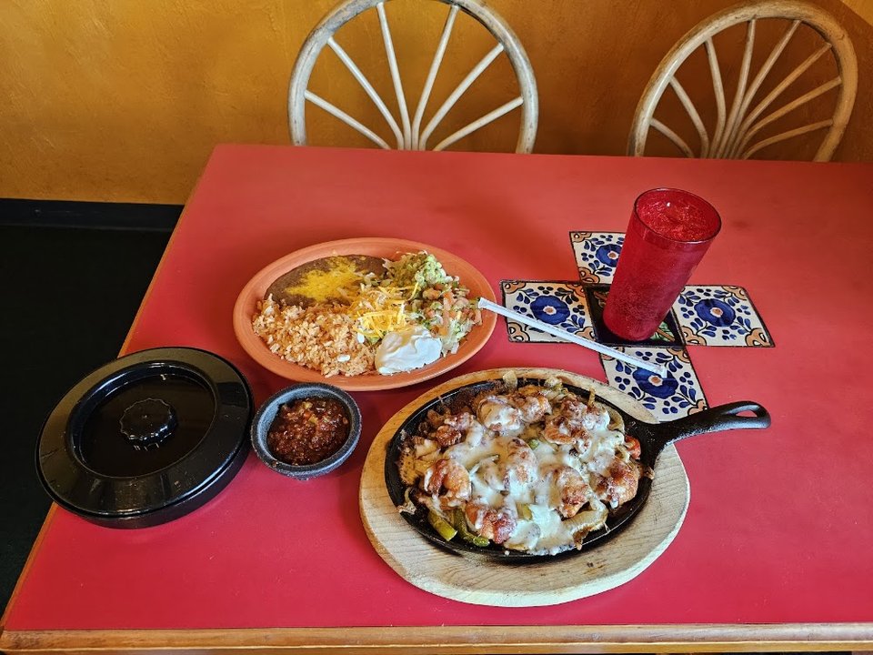 Menu page listing tacos, tostadas, and house specials.