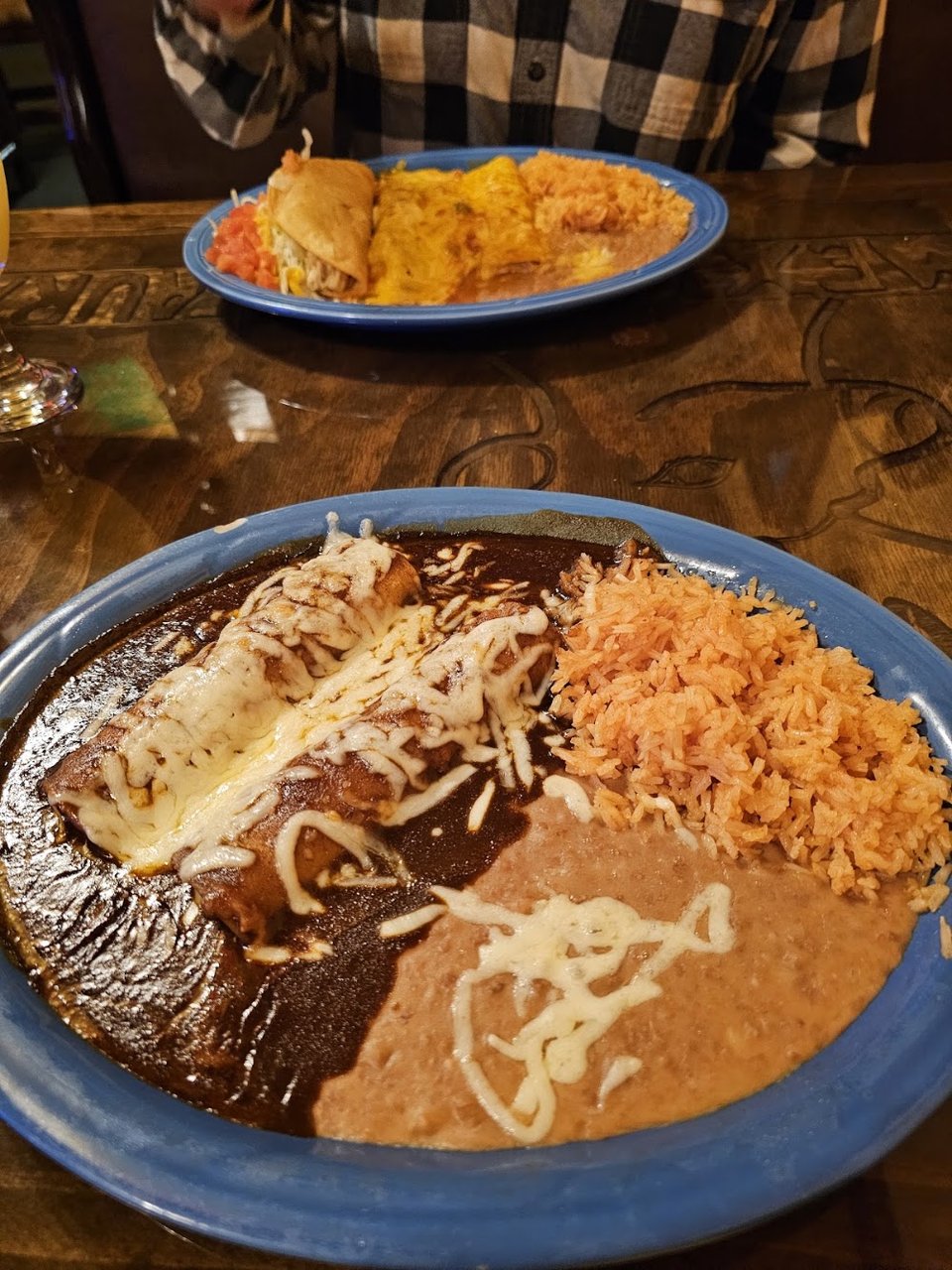 Menu close-up showing classic Mexican dishes and sides.