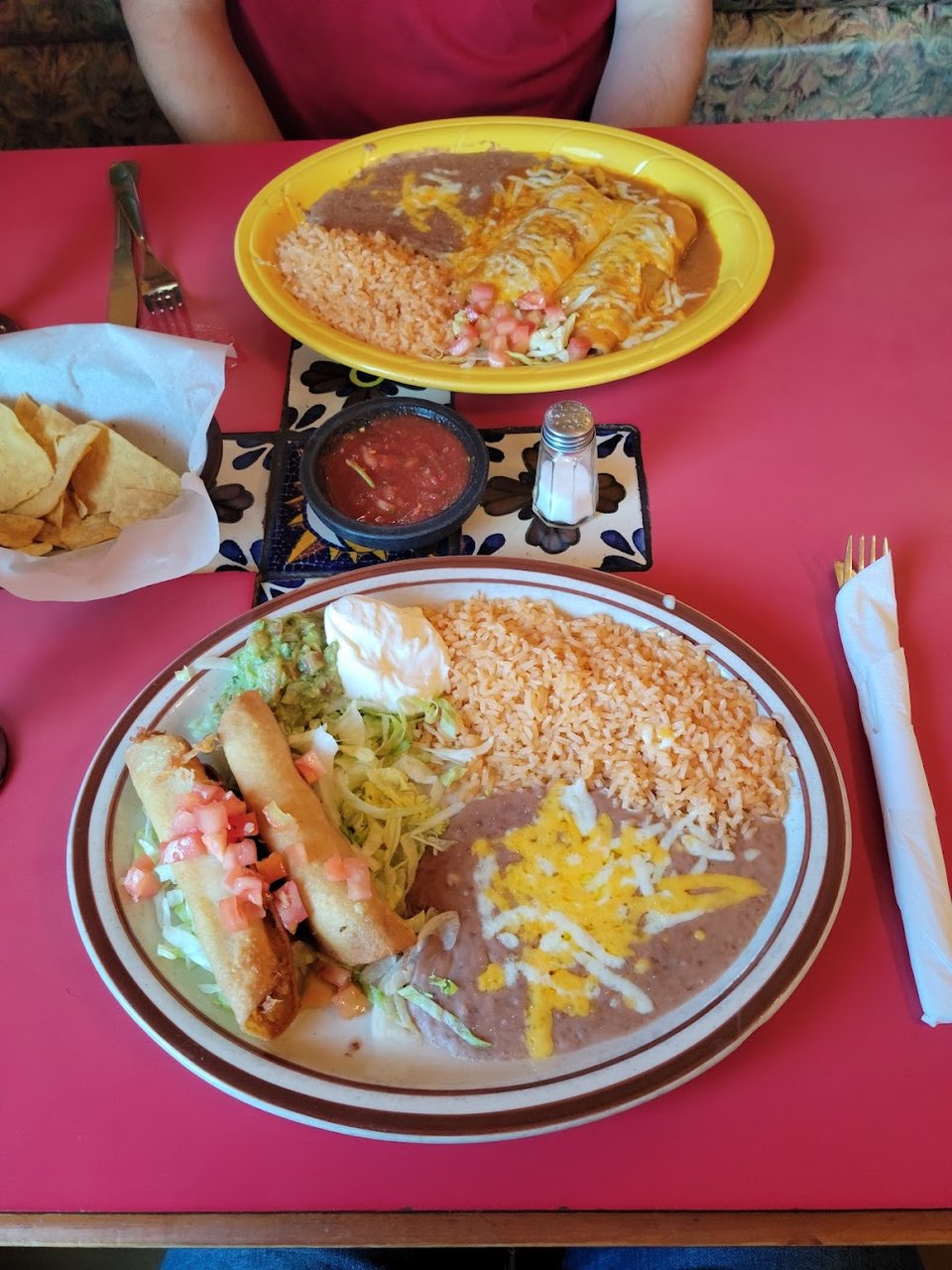 Printed menu with burritos, enchiladas, and soups.