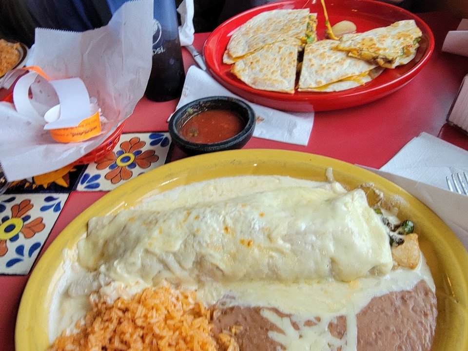 Menu page listing tacos, tostadas, and house specials.