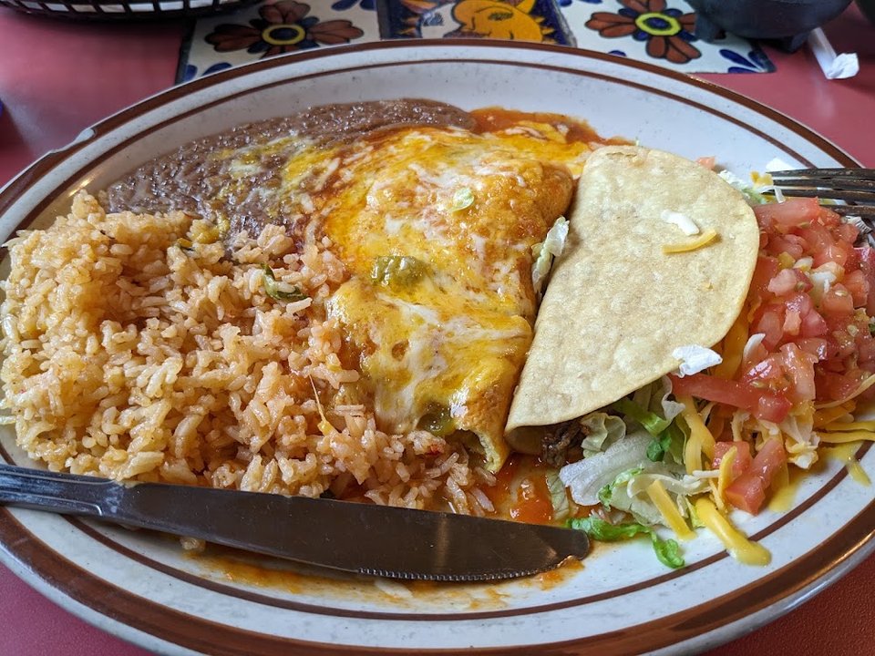 Printed menu with burritos, enchiladas, and soups.
