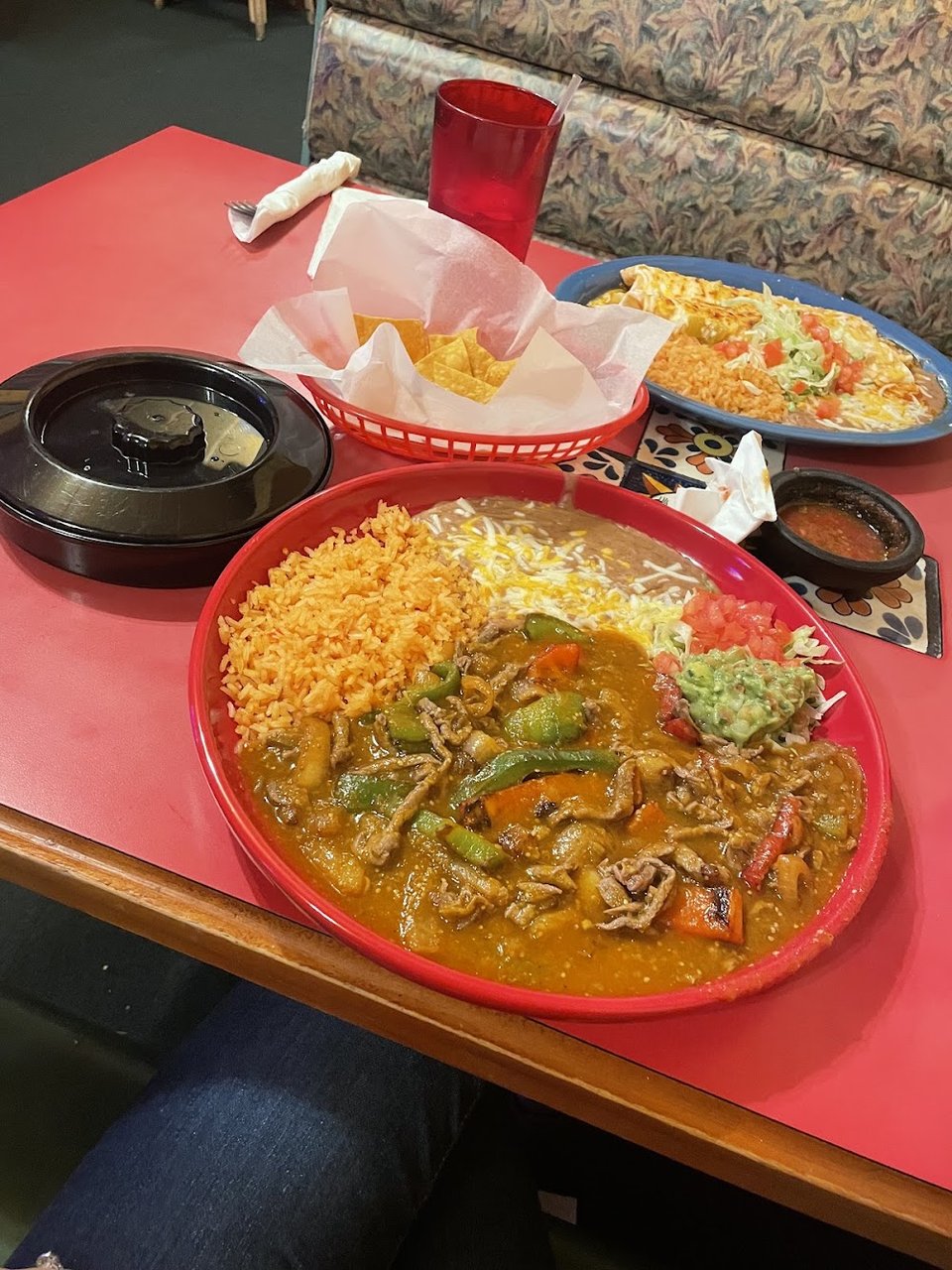 Menu close-up showing classic Mexican dishes and sides.