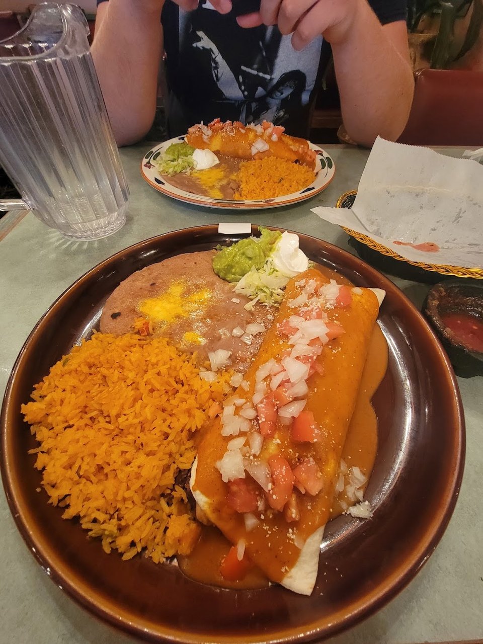 Printed menu with burritos, enchiladas, and soups.
