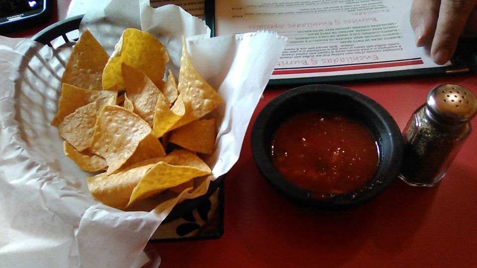 Printed menu with burritos, enchiladas, and soups.